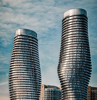 grey high rise building under blue sky during daytime